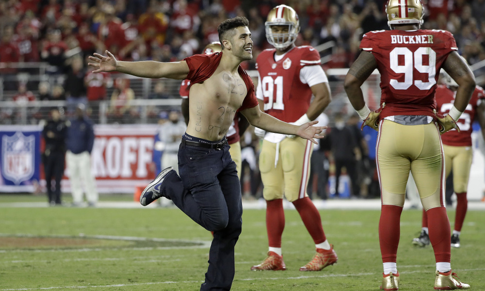 Super Bowl fan runs onto field during second half of game